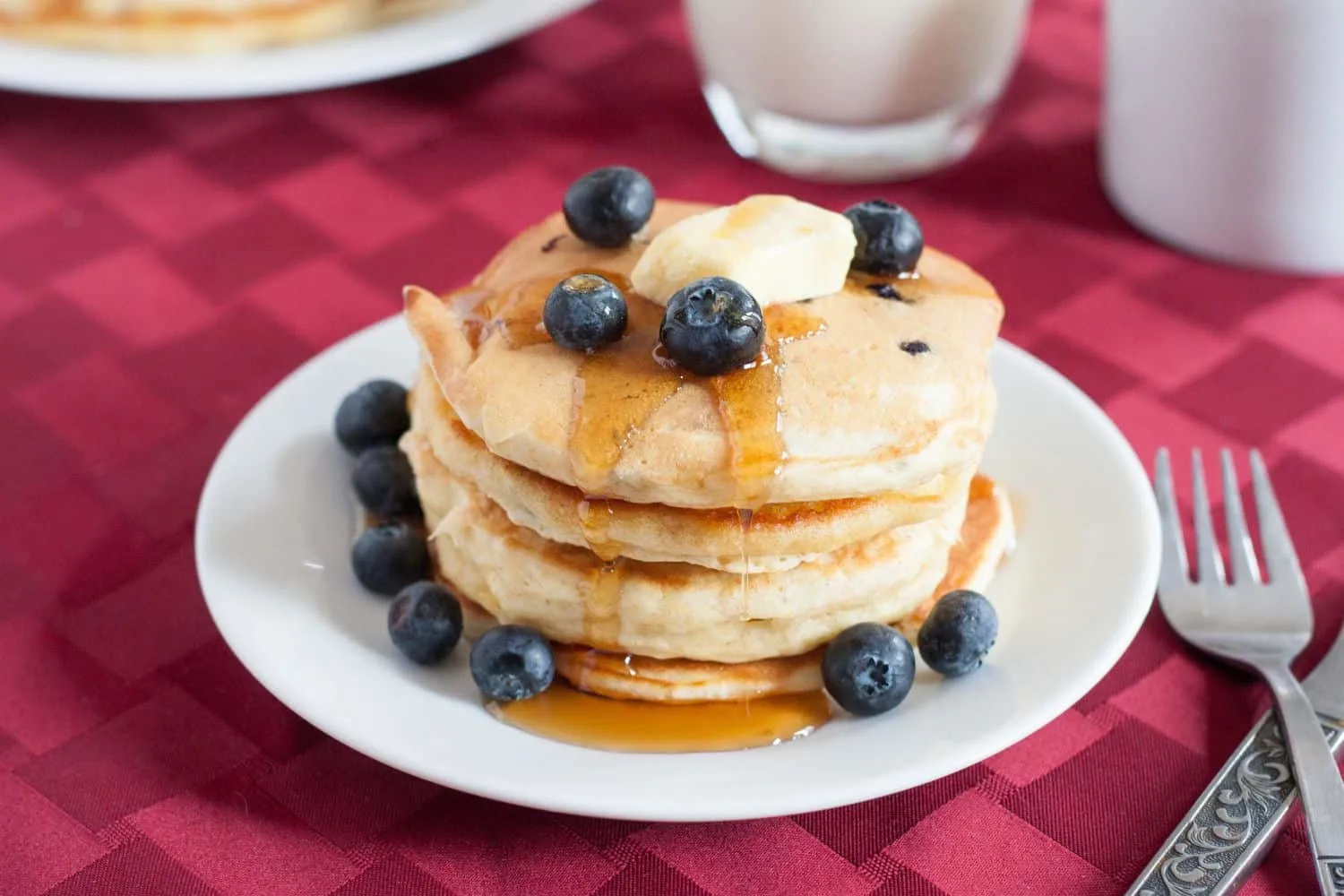 Make fluffy blueberry pancakes a little healthier by adding golden flax. Kid and husband approved! Recipe on GoodieGodmother.com
