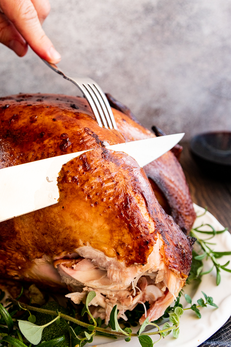 thanksgiving turkey ready to carve. Golden skin still on the turkey breast