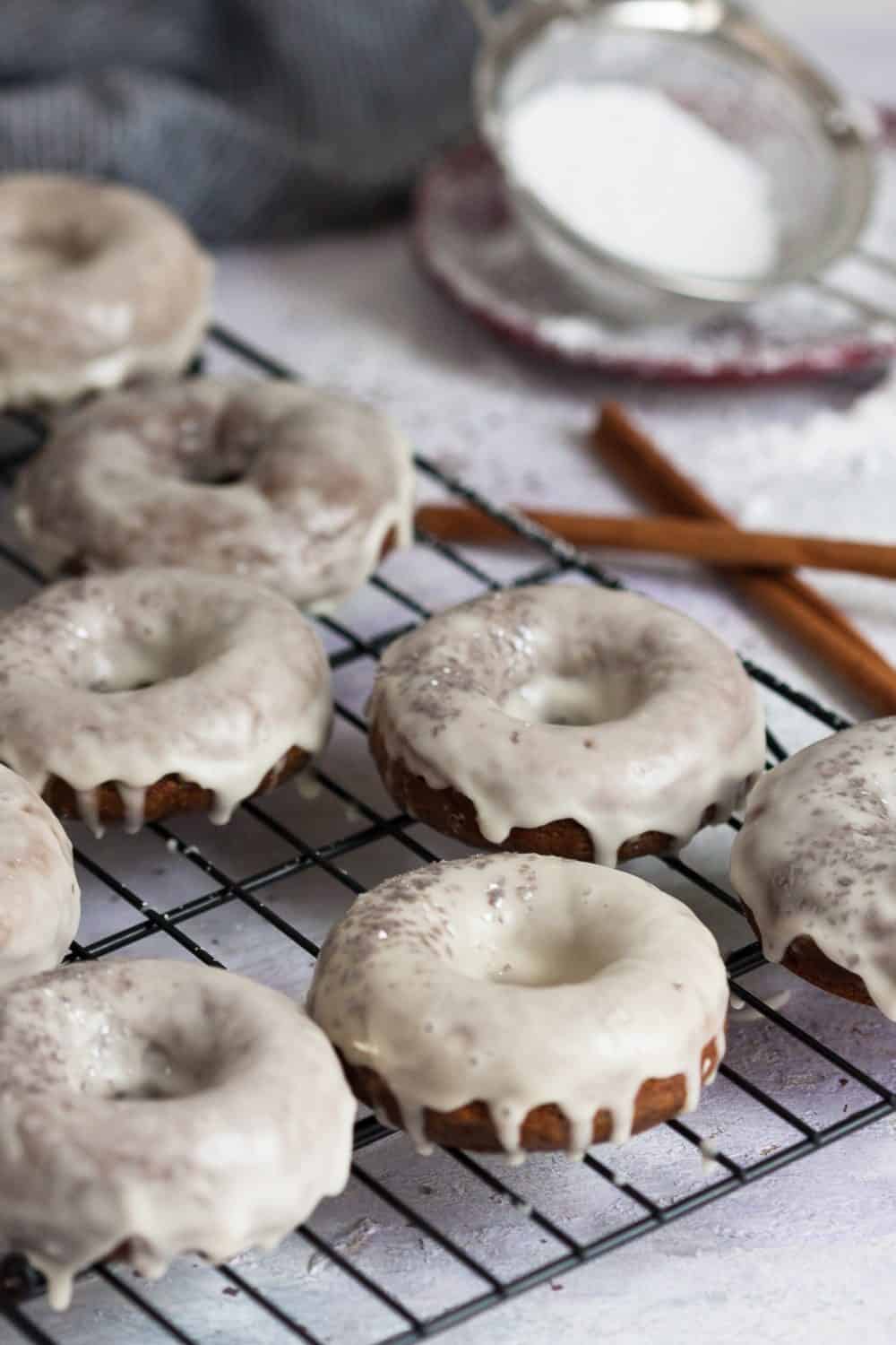 Baked gingerbread doughnuts with a maple glaze are a higher protein "nicer" Christmas breakfast treat! * Recipe on GoodieGodmother.com