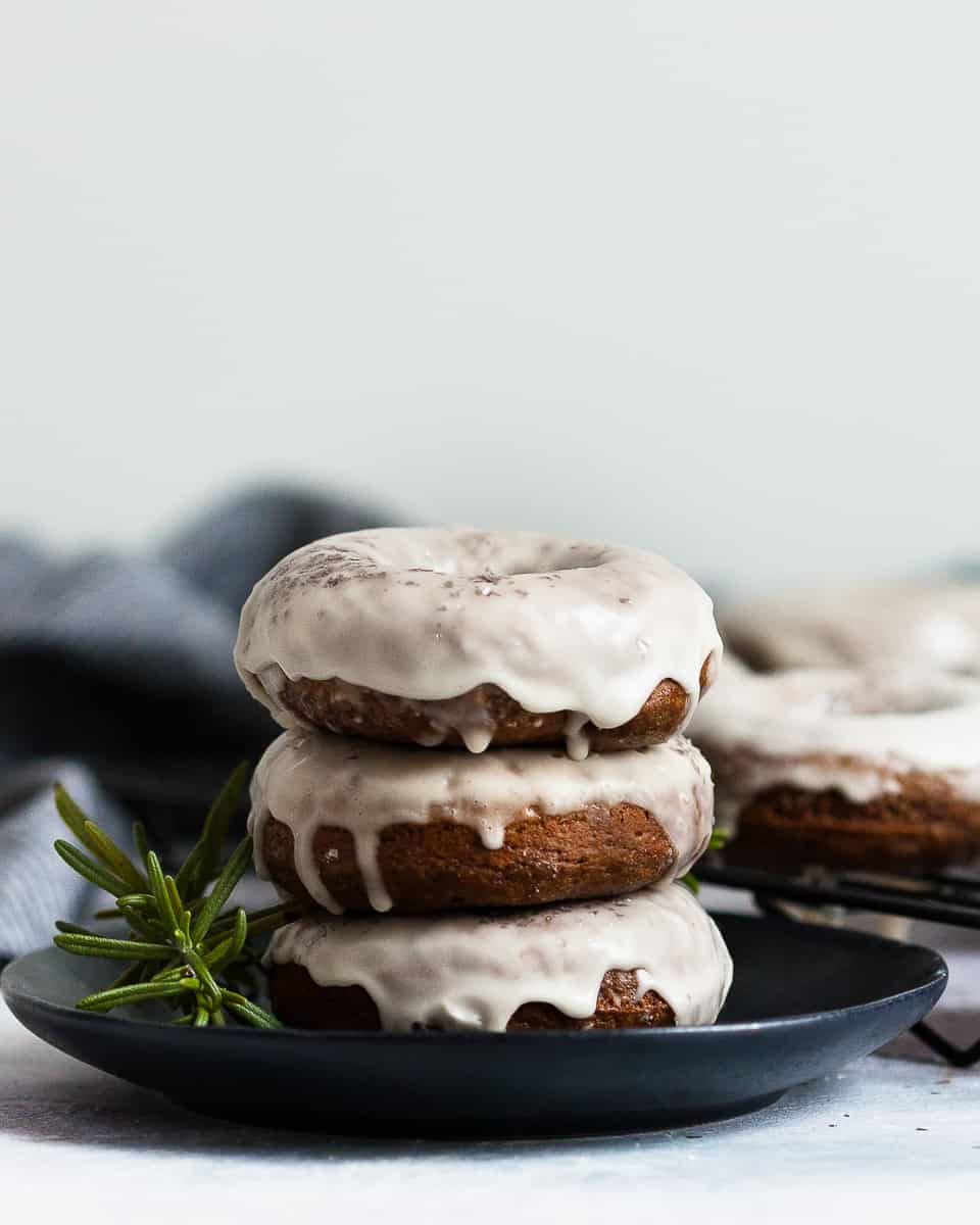Baked gingerbread doughnuts with a maple glaze are a higher protein "nicer" Christmas breakfast treat! * Recipe on GoodieGodmother.com