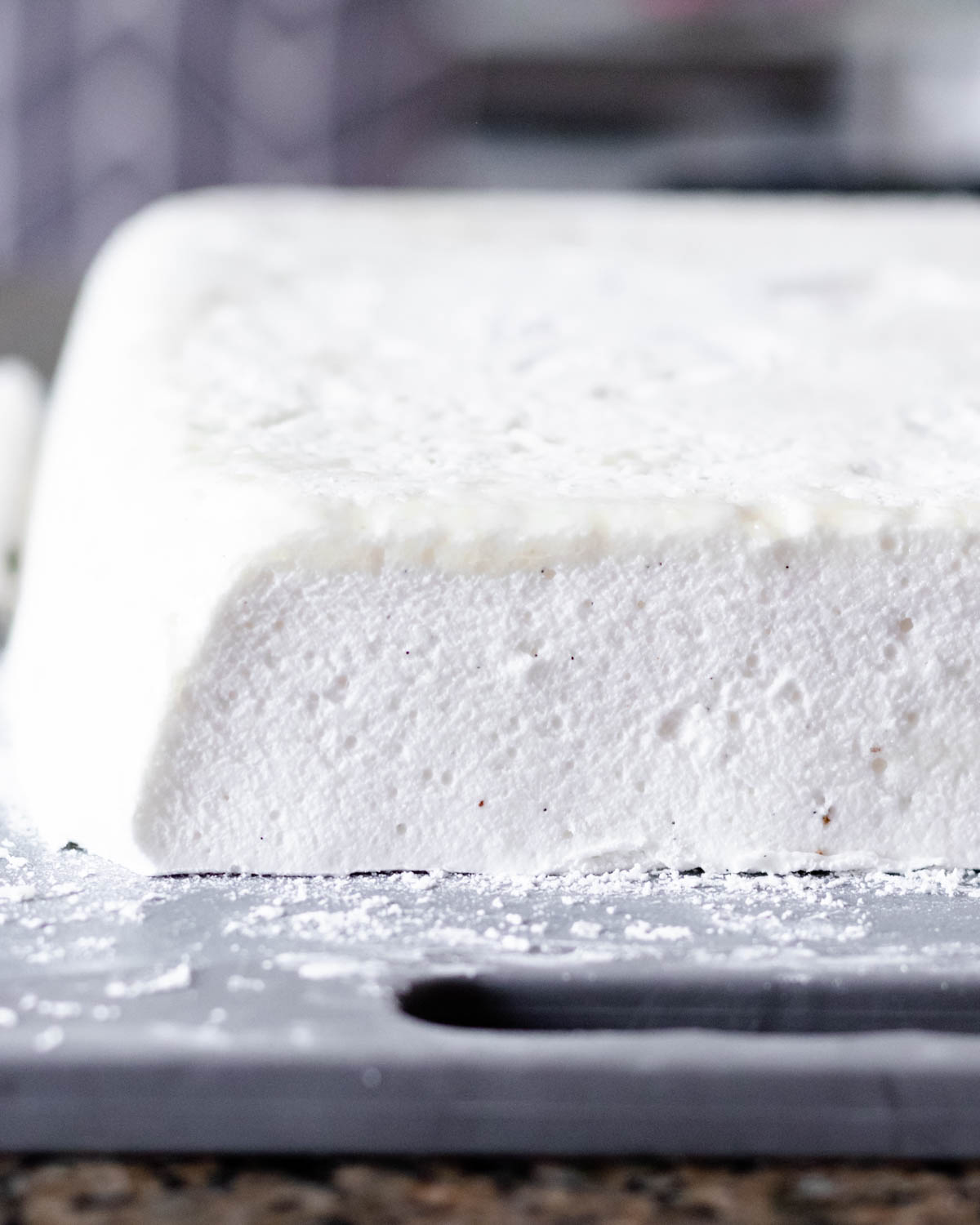 close up of a cross-section of the sheet of vanilla marshmallows to highlight the fluffy texture
