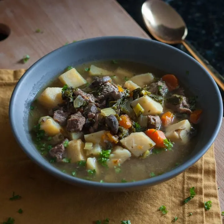 Stay warm when it's cold with nourishing food like this veggie packed winter kale beef soup recipe! * GoodieGodmother.com