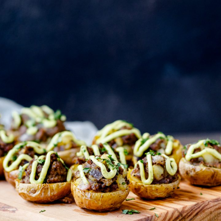 beef potato bites on a wooden serving tray