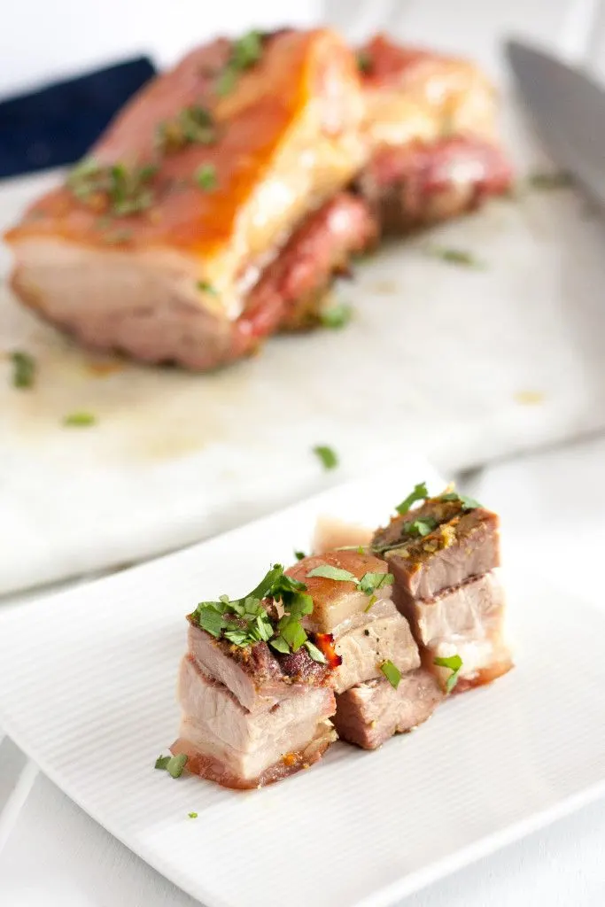Crispy Pork Belly is easy to make in the oven. This recipe has a beautiful blend of flavors like tumeric, garlic, and cinnamon, so the leftovers are even better! Serve freshly roasted for Chinese New Year or cut into cubes and slices and pan fry for an extra crispy treat!