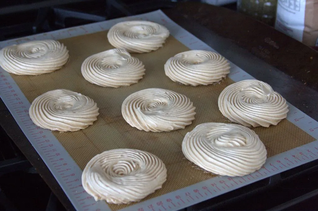 I piped my meringues to be about 3.5" across, good for two to share one assembled mervielleux