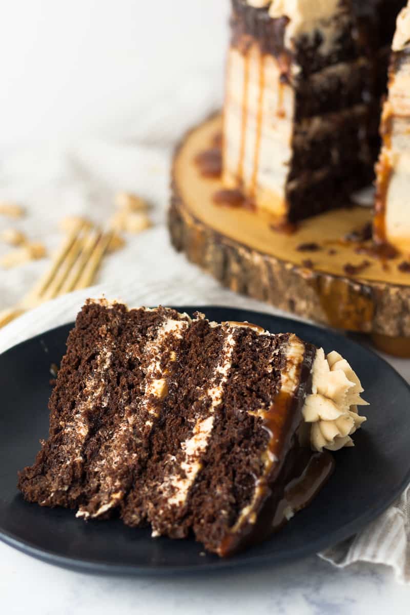 Salted Caramel Peanut Butter Chocolate Cake - rich chocolate cake layered with salted caramel and a from scratch peanut butter frosting * Recipe on GoodieGodmother.com