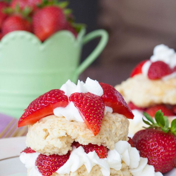 Easy strawberry shortcake recipe for summer! Perfectly textured shortcake layered with homemade whipped cream and bright red strawberries!