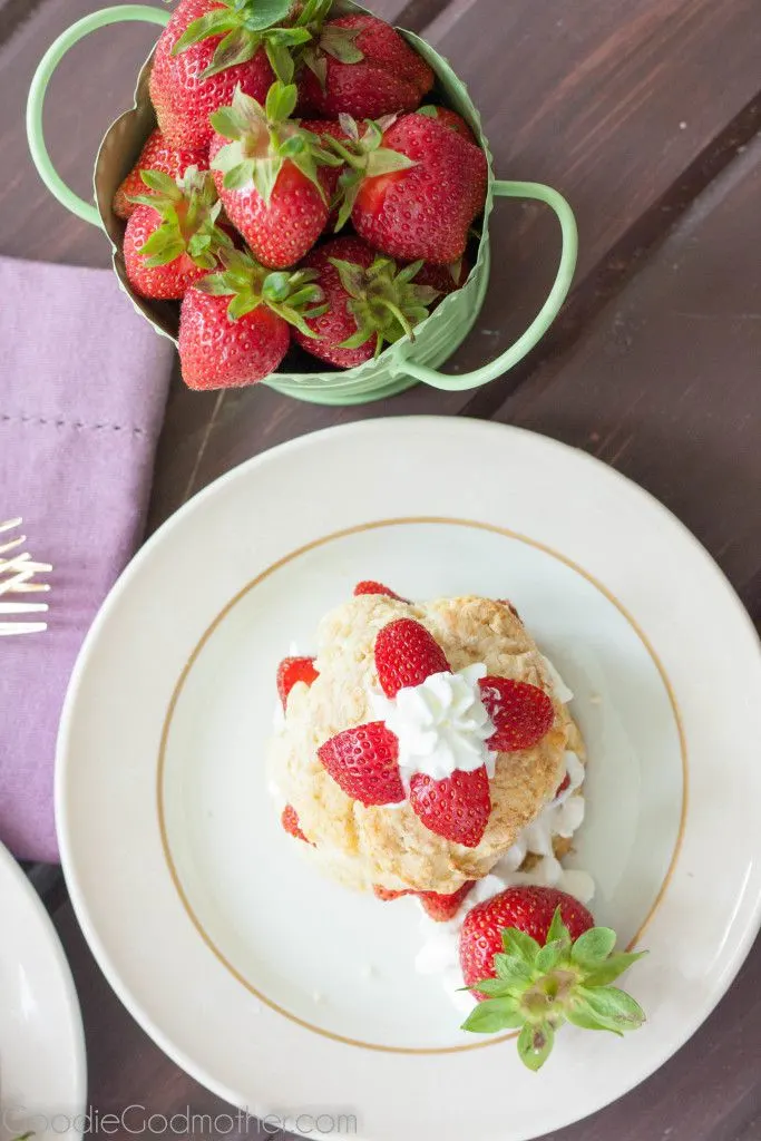Easy strawberry shortcake recipe perfect for summer! Perfectly textured shortcake layered with homemade whipped cream and bright red strawberries!