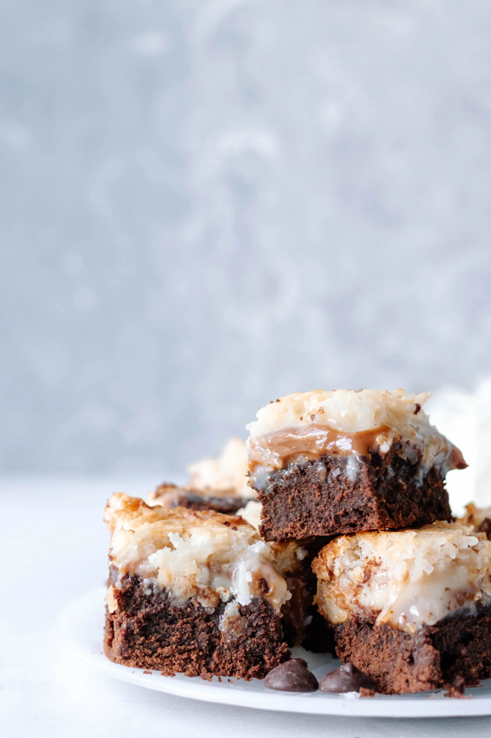 close up of the sliced dulce de leche coconut brownies to show the textures in each layer