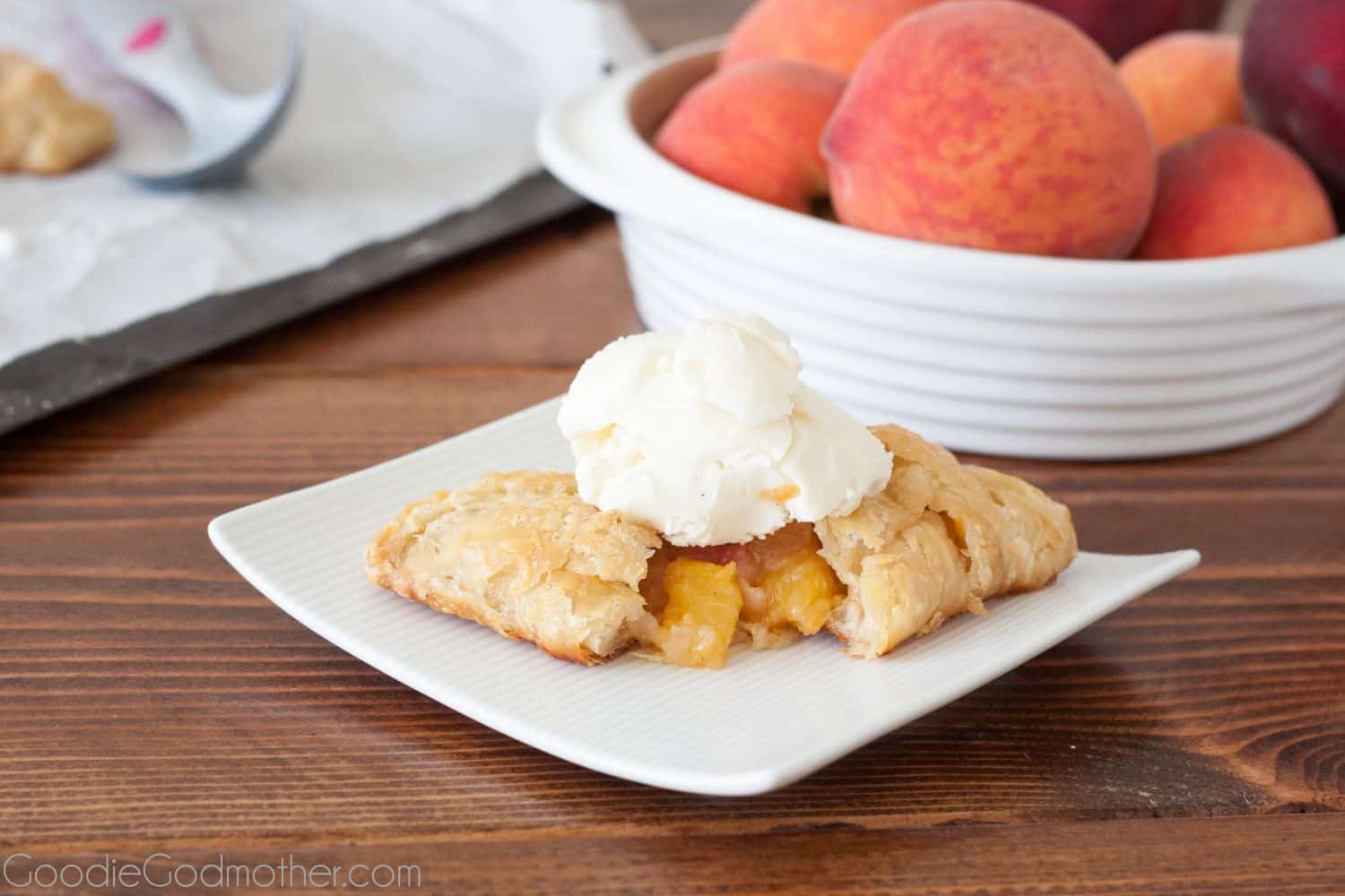 Summer peaches make a perfect filling for flaky peach hand pies with an all butter crust. Recipe on GoodieGodmother.com