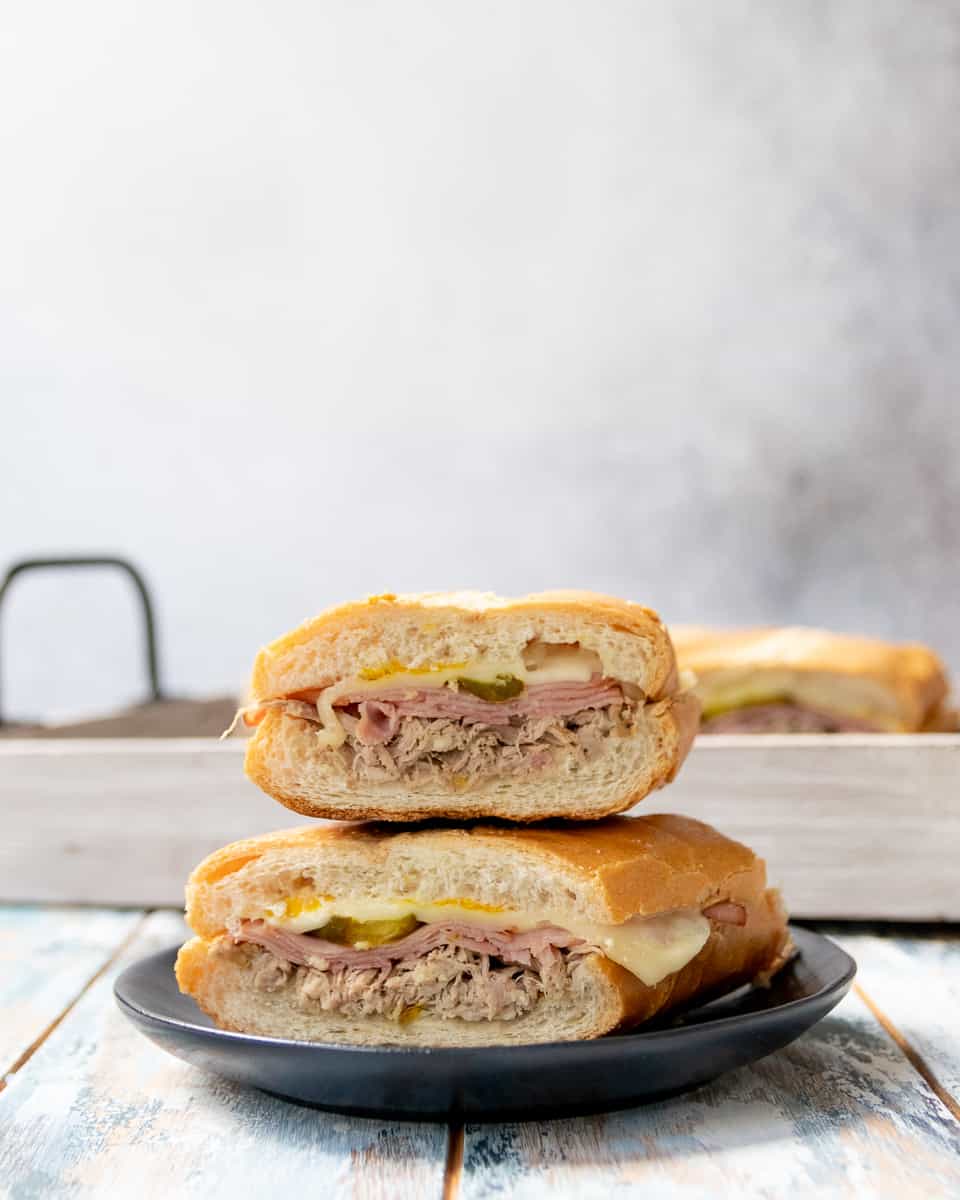 Enjoy Miami-worthy Cuban sandwiches at home with this easy and authentic Cuban sandwich recipe. The secret is in the pork, which you make in your slow cooker or pressure cooker! * Recipe on GoodieGodmother.com
