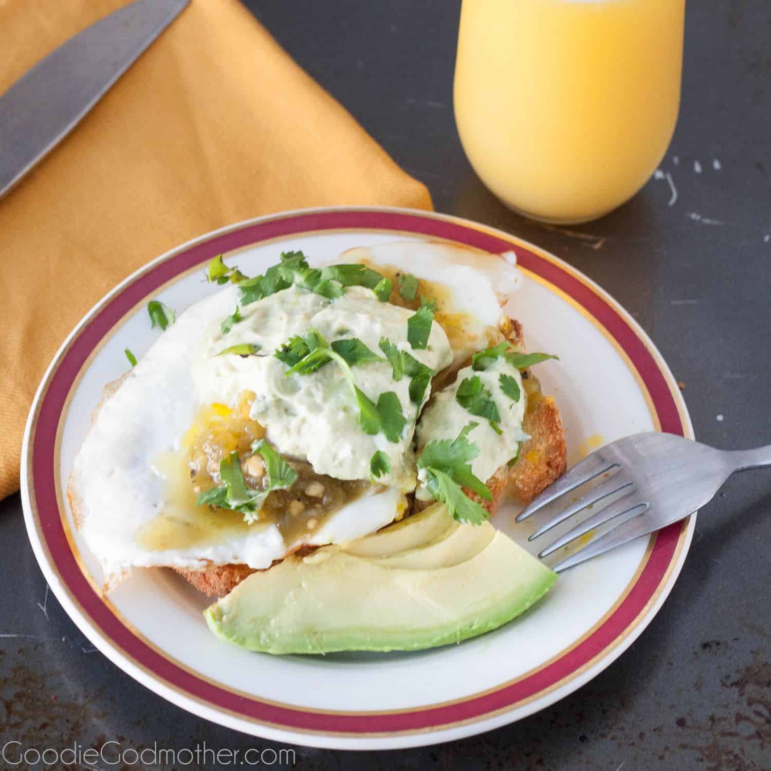Savory avocado whipped cream tops an open face breakfast sandwich that looks (and tastes) like it came from your trendy neighborhood bistro! Recipe on GoodieGodmother.com
