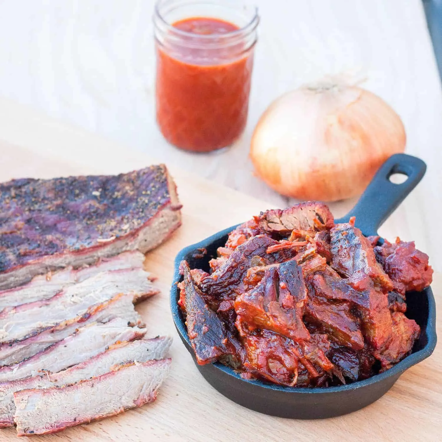 Learn how to make a butter-knife-tender brisket and burnt ends in a Saint Louis-style barbecue sauce. Recipe and directions on GoodieGodmother.com