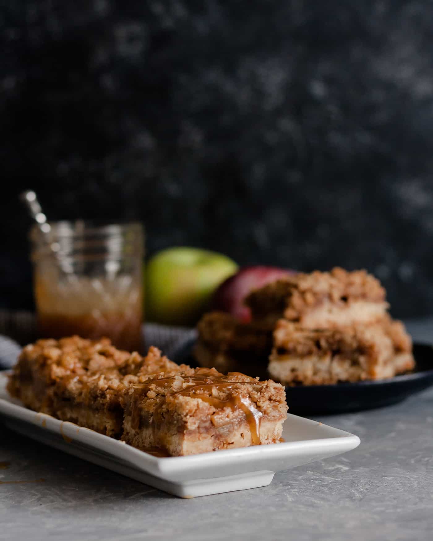 These popular caramel apple bars are a go-to recipe for a crowd. Drips of caramel, loads of apple flavor, and browned butter make these bars a favorite dessert!  * Caramel Apple Bar Recipe on GoodieGodmother.com