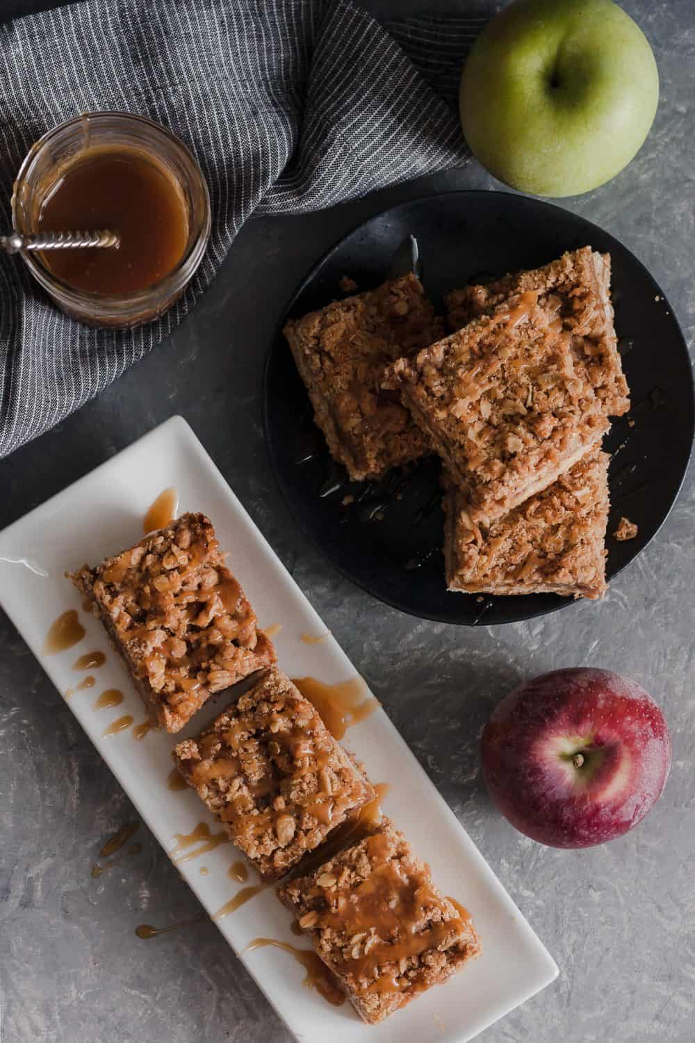 These popular caramel apple bars are a go-to recipe for a crowd. Drips of caramel, loads of apple flavor, and browned butter make these bars a favorite dessert!  * Caramel Apple Bar Recipe on GoodieGodmother.com