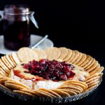 Baked brie is an impressive, yet easy holiday appetizer! This recipe tops the baked brie with a fresh cranberry balsamic compote that keeps you coming back for bite after bite!