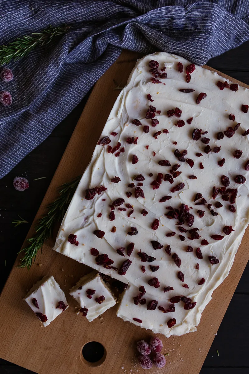 top view of cranberry orange bars on a cutting board