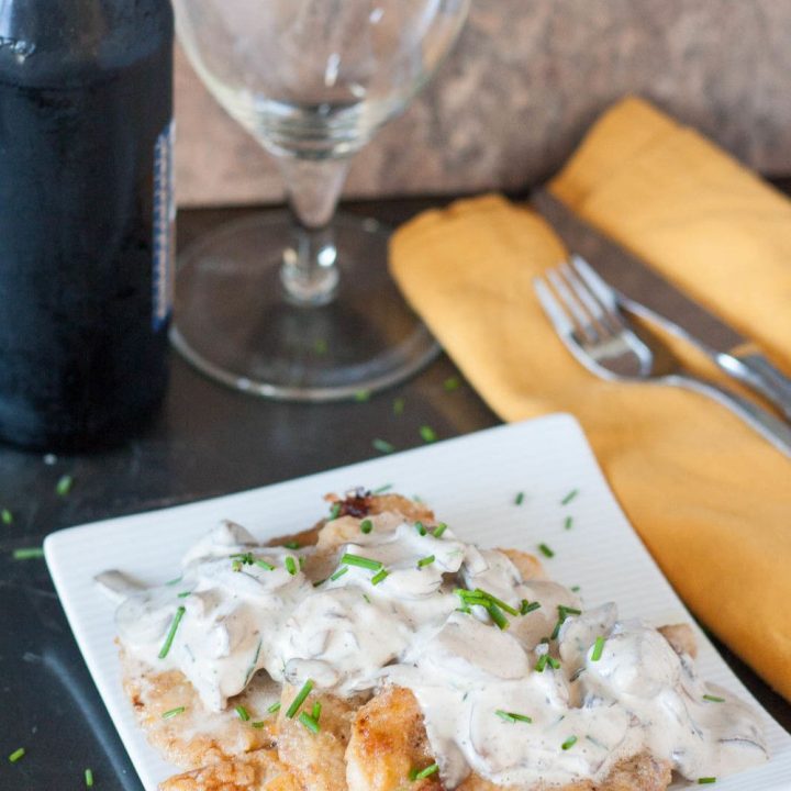 An authentic German recipe for Rahmschnitzel - schnitzel with a from scratch mushroom cream sauce.