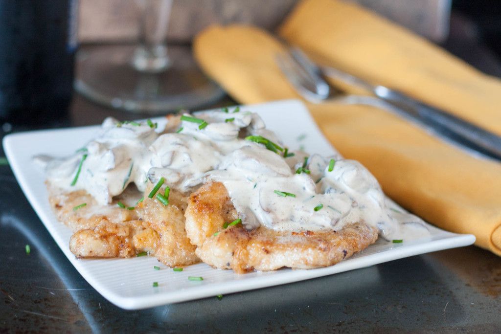 An authentic German recipe for Rahmschnitzel - schnitzel with a from scratch mushroom cream sauce. 