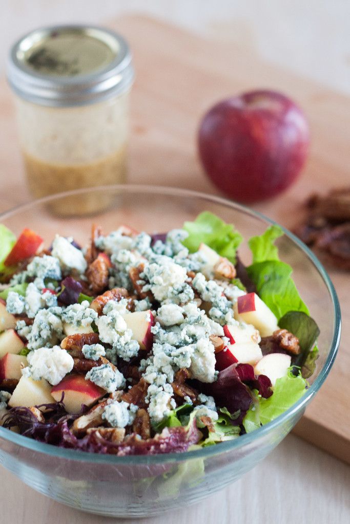 This salad is perfect for fall! Blue cheese crumbles, quick candied pecans, fresh apples, dark leafy greens, and an easy red wine vinaigrette. It's healthy fall comfort food! 