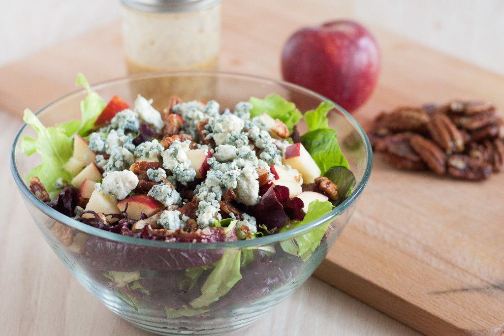 This salad is perfect for fall! Blue cheese crumbles, quick candied pecans, fresh apples, dark leafy greens, and an easy red wine vinaigrette. It's healthy fall comfort food! 