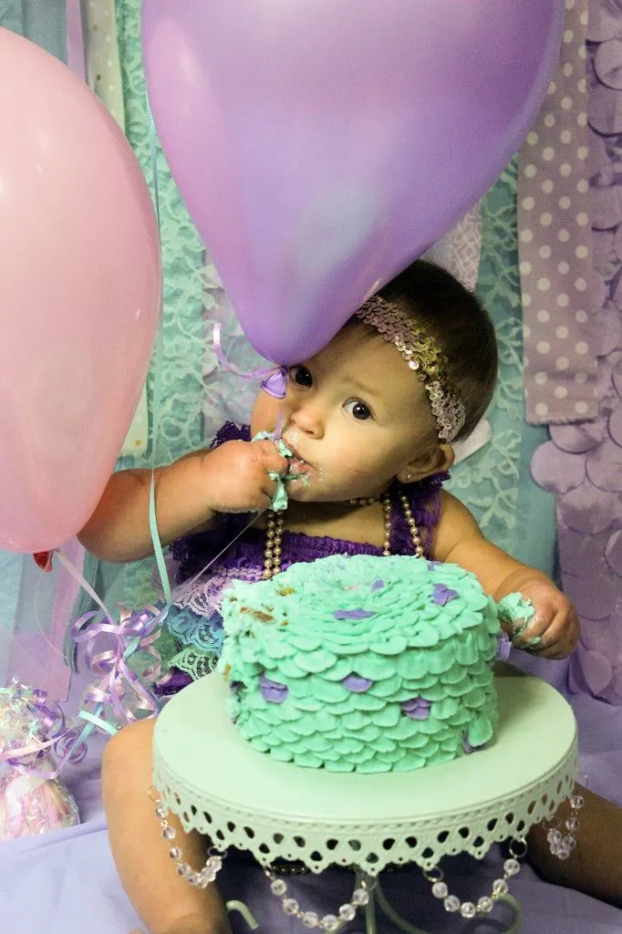 Learn how to make a buttercream MERMAID smash cake perfect for first birthday photos! Blog post includes plenty of helpful tips, even for beginners, and a video.