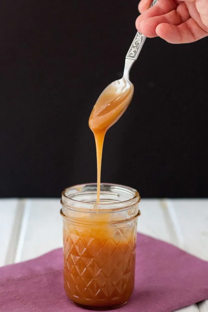 An easy to follow recipe for homemade caramel sauce that stays soft - even in the refrigerator! Perfect for dipping apple slices or pretzels or drizzling over desserts or into hot chocolate or lattes. 