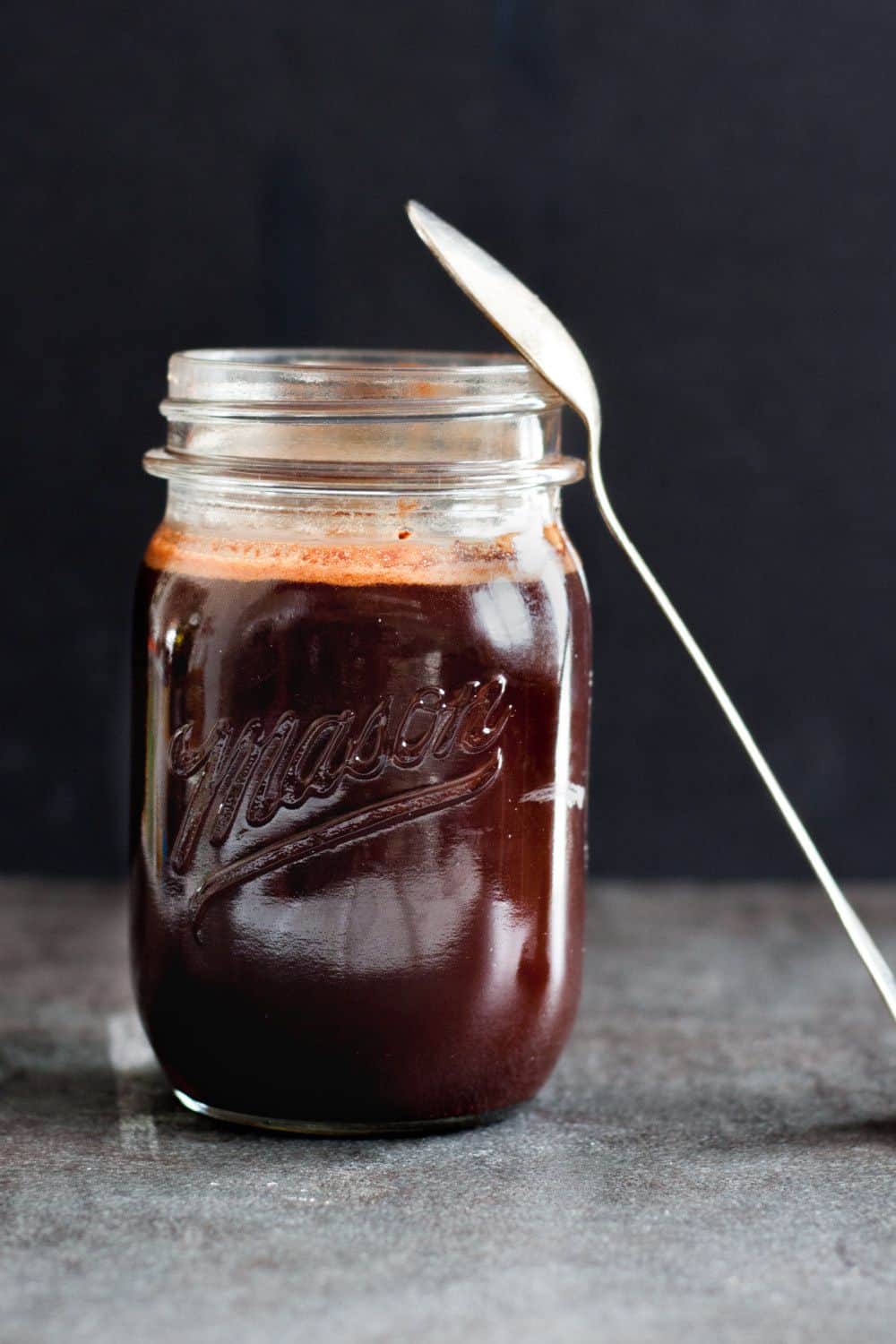 Make your own chocolate sauce - with no corn syrup! Cooks up in minutes, and is ready to make easy chocolate milk or drizzle over ice cream, into coffee or hot chocolate, or over cakes or cupcakes! Recipe on GoodieGodmother.com