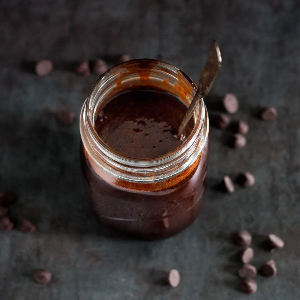 Make your own chocolate sauce - with no corn syrup! Cooks up in minutes, and is ready to make easy chocolate milk or drizzle over ice cream, into coffee or hot chocolate, or over cakes or cupcakes! Recipe on GoodieGodmother.com