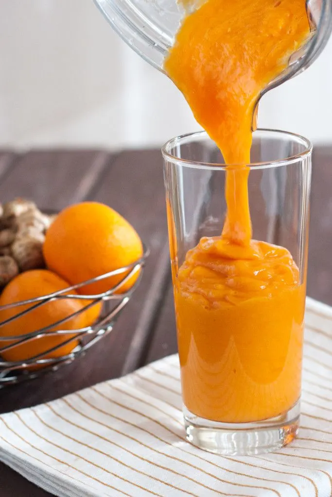 Fresh turmeric smoothie recipe - Mango, fresh turmeric, carrots, ginger, and more make this vitamin and antioxidant loaded vegan smoothie a delicious way to start the day!