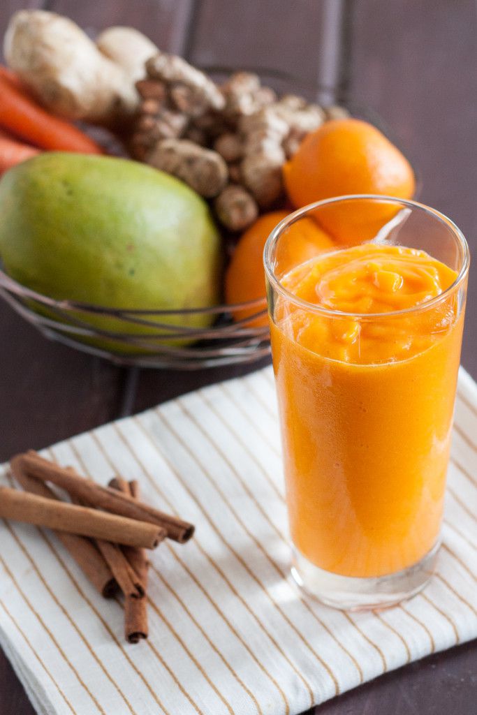 Fresh turmeric smoothie recipe - Mango, fresh turmeric, carrots, ginger, and more make this vitamin and antioxidant loaded vegan smoothie a delicious way to start the day! 