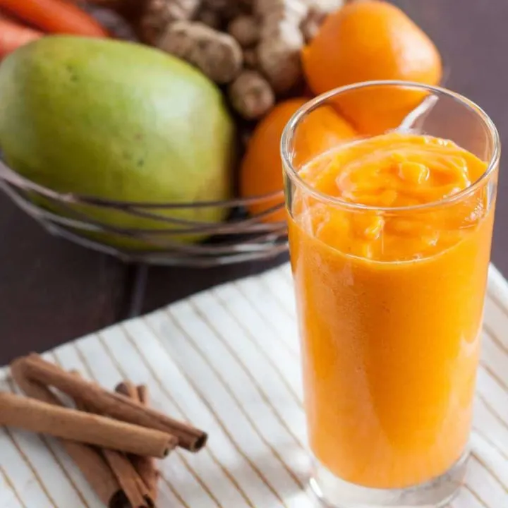 Fresh turmeric smoothie recipe - Mango, fresh turmeric, carrots, ginger, and more make this vitamin and antioxidant loaded vegan smoothie a delicious way to start the day!