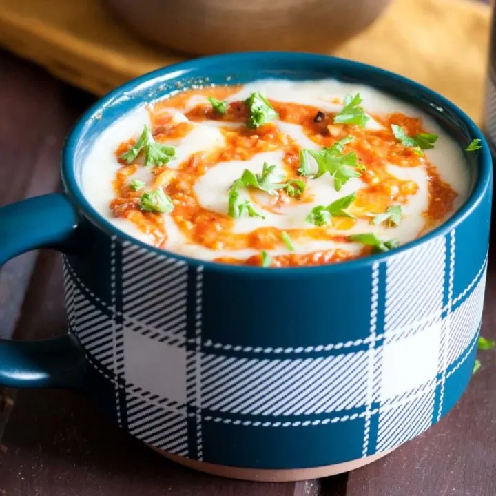 A classic potato soup recipe is extra delicious topped with romesco sauce! It's a great weeknight dinner idea, and reheats well for lunch the next day. Recipe on GoodieGodmother.com