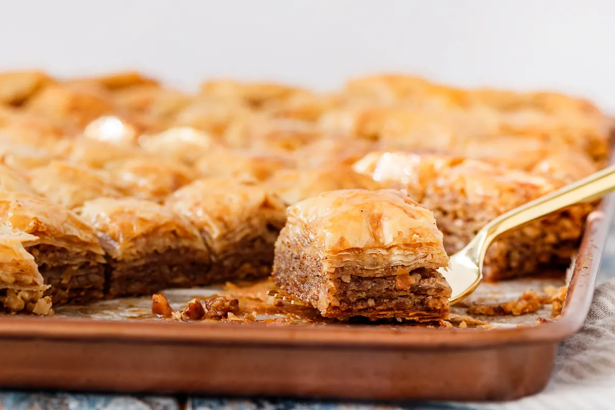 side shot of the baklava on a fork to show off layers