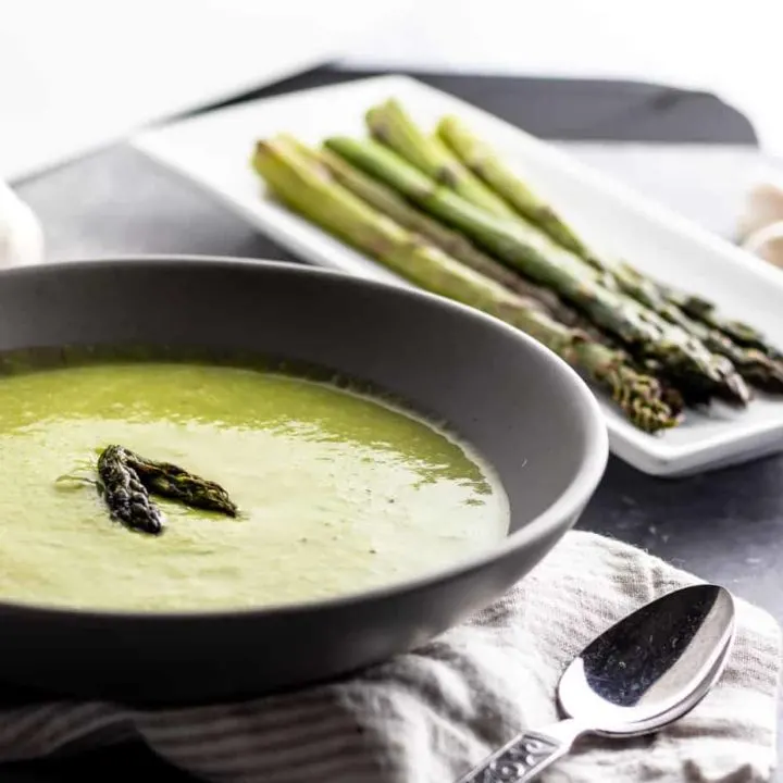 Welcome the coming of warmer days, even on cooler evenings, with this delicious Asparagus Garlic Soup. It's one of my favorite easy asparagus recipes to enjoy during asparagus season!