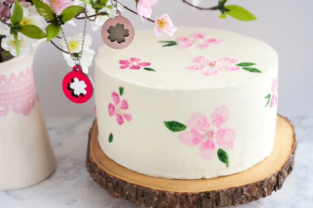 Check out this cherry blossom cake tutorial to learn how to decorate a cherry blossom cake by painting on buttercream! Tutorial, FREE stencil printable, and video on GoodieGodmother.com