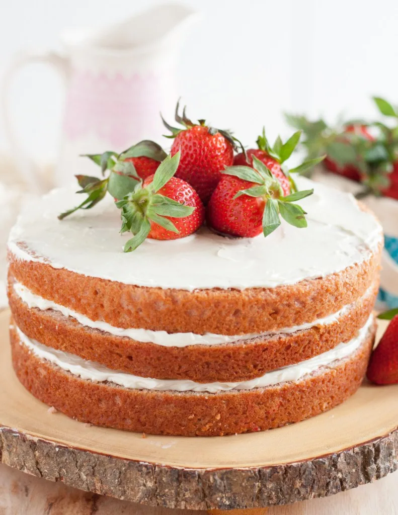 No artificial colors, all natural flavor, this fresh strawberry cake from scratch is a perfect dessert for strawberry season! * GoodieGodmother.com