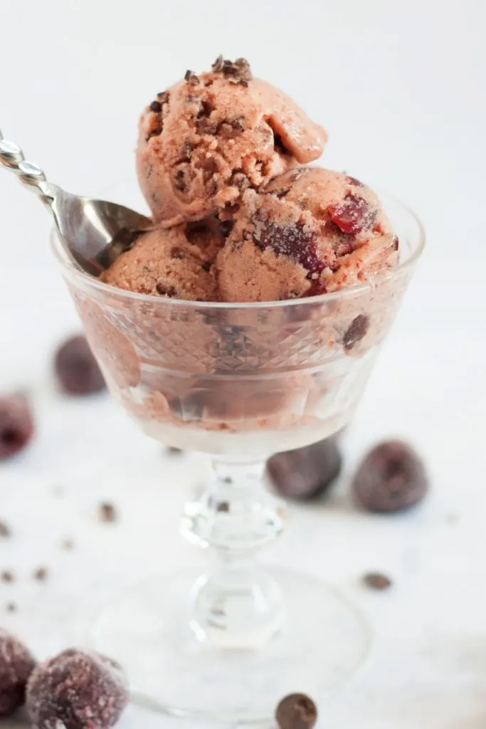 A unique banana ice cream flavor inspired by Cherry Garcia! This chocolate cherry banana ice cream is easy to make, soft straight out of the freezer, and is a "clean eating" dessert! * GoodieGodmother.com