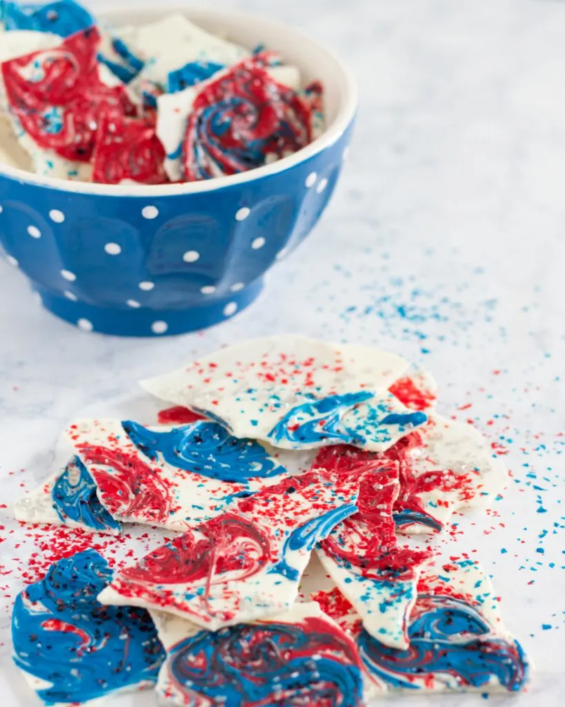 This fireworks inspired bark is a simple no bake dessert perfect to make with kids for any patriotic holiday. * How-to and video on GoodieGodmother.com