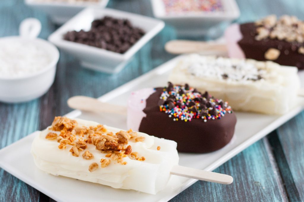 Set up a chocolate dipping station for fruit pops at your next summer party! It's an easy and interactive dessert your guests will love! #ad #SnackBrighter
