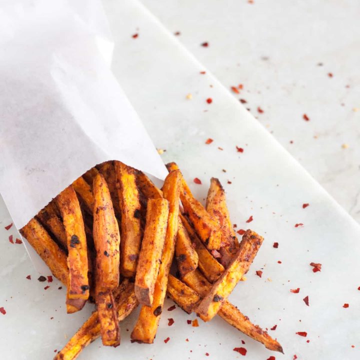 With less fat than a fried potato, these baked chipotle sweet potato fries pack a kick and make a delicious side dish or snack! * Recipe on GoodieGodmother.com
