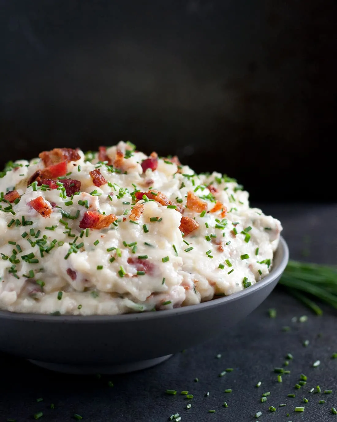 Bacon Brie Mashed Potatoes - Creamy, indulgent, totally loaded mashed potatoes. * Recipe on GoodieGodmother.com