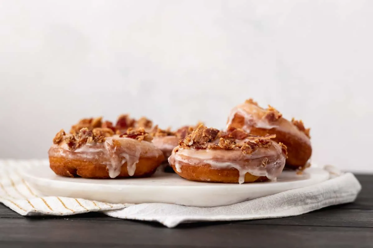 Sweet and salty are a wonderful combination and make these maple bacon doughnuts a treat that won't last long!