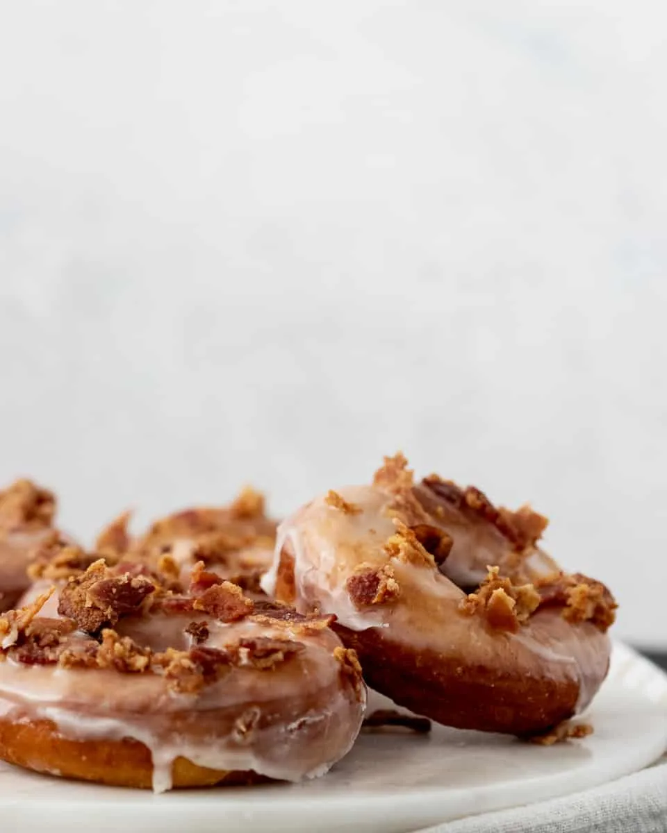 Make specialty donuts at home with this easy to follow maple bacon donut recipe!