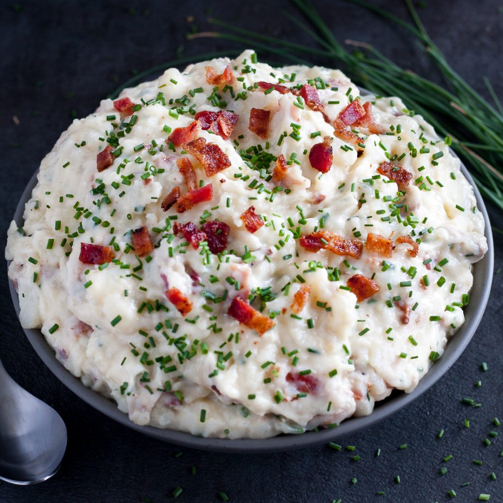 Bacon Brie Mashed Potatoes - Creamy, indulgent, totally loaded mashed potatoes. * Recipe on GoodieGodmother.com