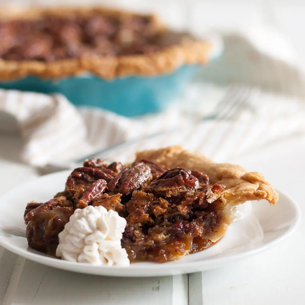 White Russian Pecan Pie - inspired a little by happy hour, a lot by a road trip, this unique pecan pie recipe is amazing! It's a must for our Thanksgiving table. * Recipe on GoodieGodmother.com