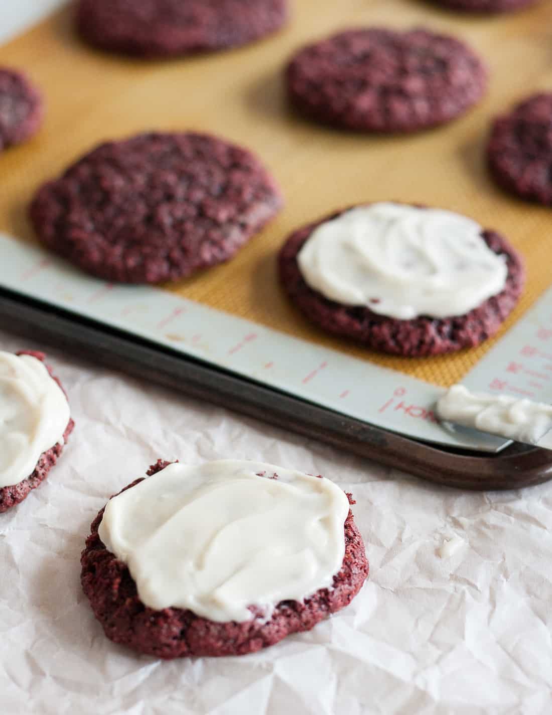 Perfect for Christmas, Valentine's Day, or really any time you need a treat, these soft frosted vegan red velvet cookies are delightful! * Recipe on GoodieGodmother.com