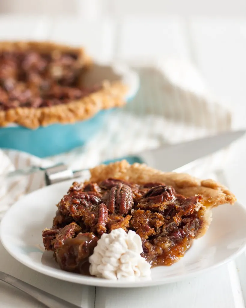 White Russian Pecan Pie - inspired a little by happy hour, a lot by a road trip, this unique pecan pie recipe is amazing! It's a must for our Thanksgiving table. * Recipe on GoodieGodmother.com