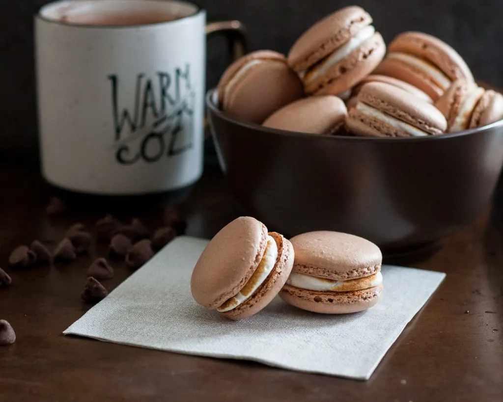 The weather outside is frightful, but hot chocolate macarons are sure to warm your heart - delightful fireplace burning or not.  * Recipe on GoodieGodmother.com