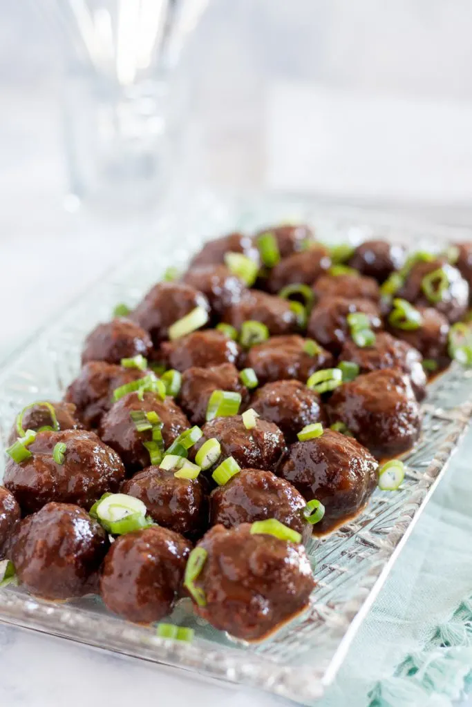 Slow cooker guava glazed meatballs is a great dish to serve at parties! This recipe is a unique spin on traditional slow cooker meatball recipes. * Recipe on GoodieGodmother.com